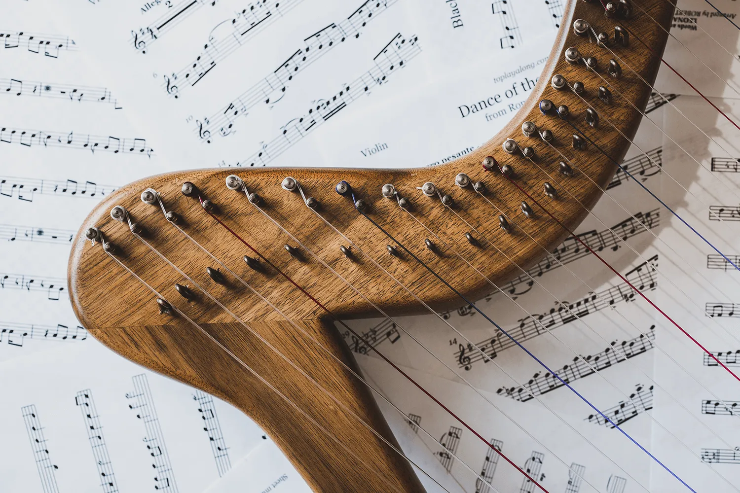 Harp on top of music sheets